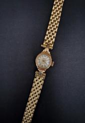 Montre-bracelet de dame en or jaune 18k bracelet maille grain de riz